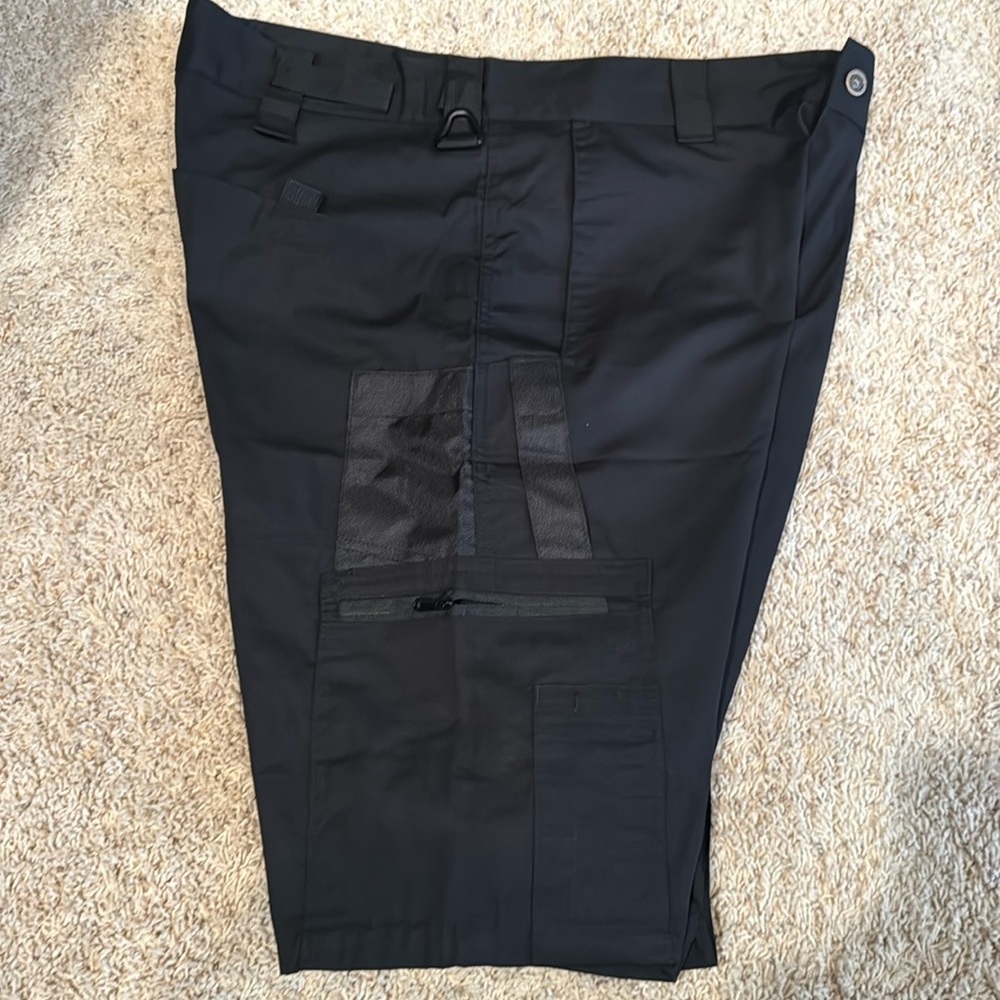 Black tactical shorts (fits like 34-36 waist). All kinds of Velcro attachments.